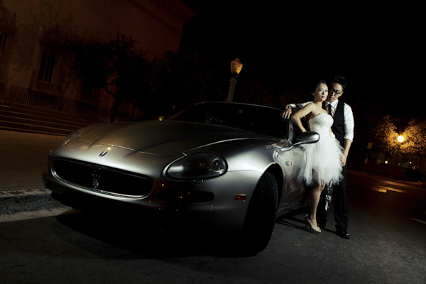 night photography of the newlywed standing by car - wedding photo by top Orange County, California wedding photographers D. Park Photography